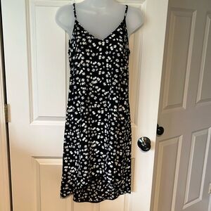 XS slip dress. Cabi. Silky black with yellow and white daisy pattern.